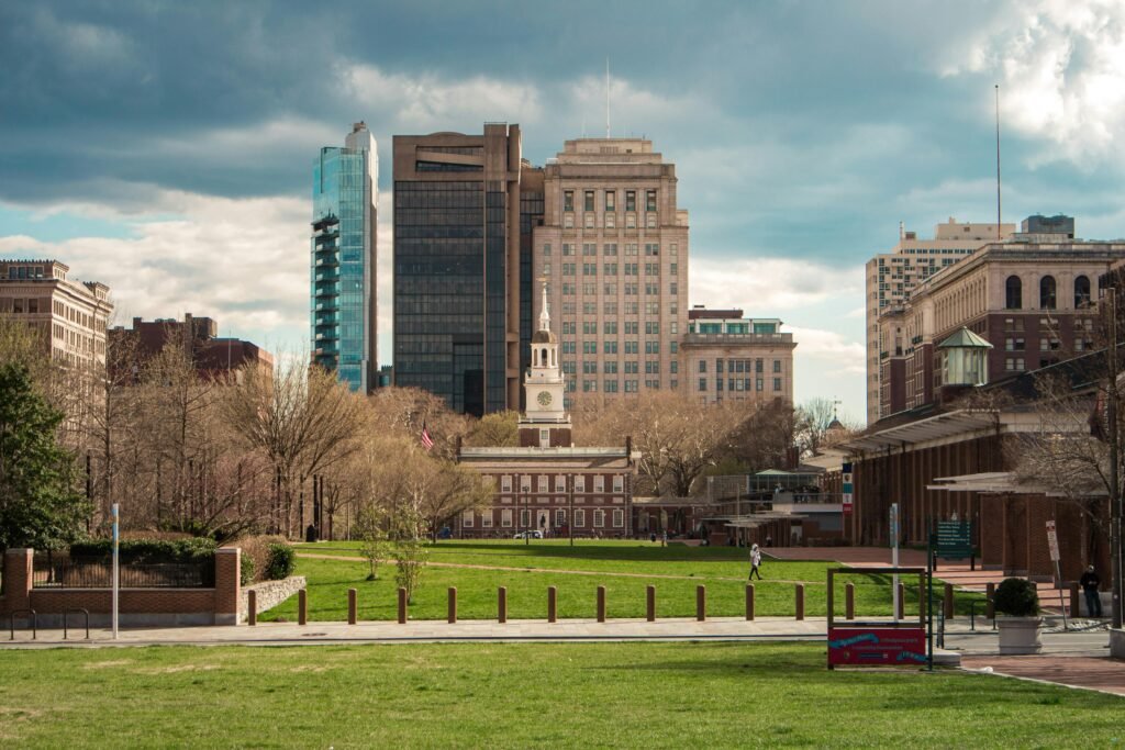 Scenic view of Independence Hall with modern Philadelphia skyline in the background.